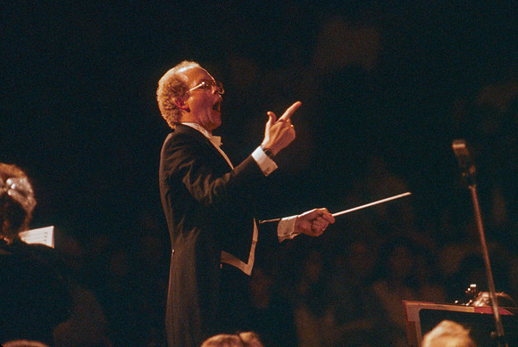 Conductor leads choir and orchestra in Visions of Eternity.