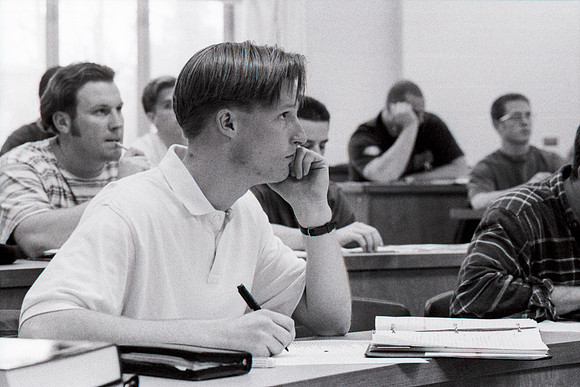 Business teacher, Phillip Packer teaches students in the classroom. December 1995.
