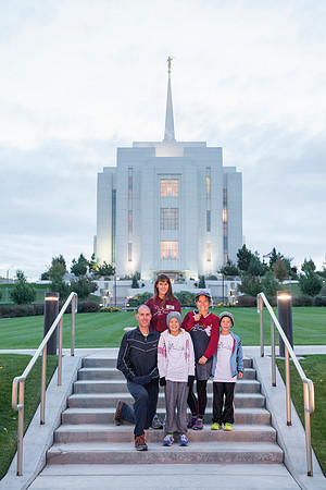 Team members pose by the Rexburg temple before they begin the temple to temple run