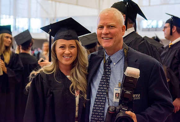 Graduate, Katelyn Cromptym, and Mike Lewis before the commencement ceremony.