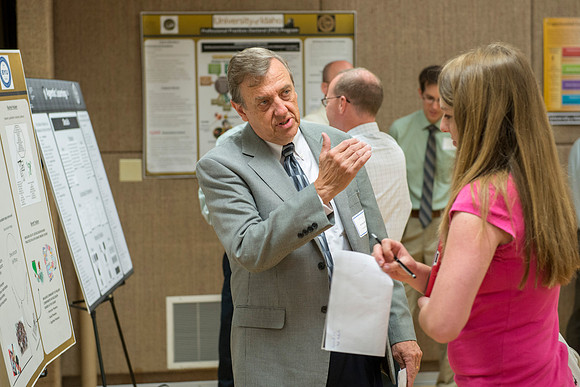 Faculty gather in the Hinckley Building at a Faculty Conference to share and learn from each other at the beginning of the 2013 Fall semester.