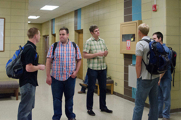 Students talking in the Mark Austin Building