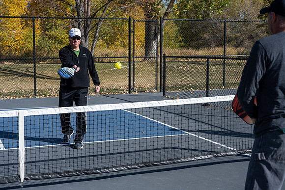 Dinking around playing pickleball for the HR Wellness Video. Michael Ballard