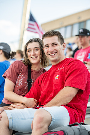 Students gather at the stadium to watch the football championship.