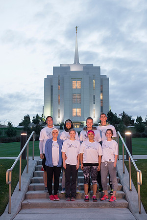 Team members pose by the Rexburg temple before they begin the temple to temple run