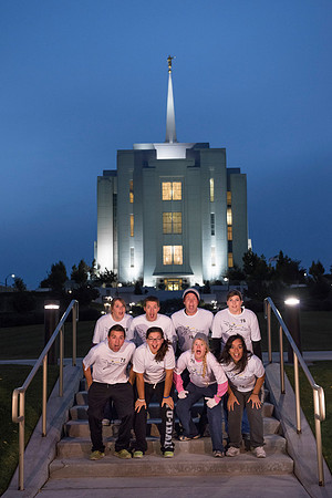 Team members pose by the Rexburg temple before they begin the temple to temple run