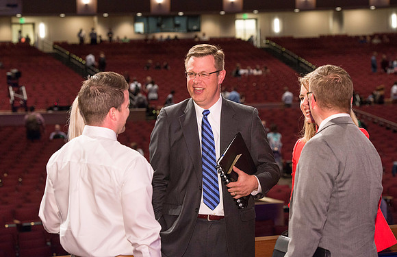 President and Sister Gilbert greet students after the first devotional of the semester.