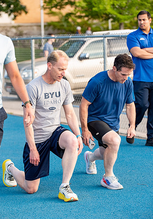 Faculty and community members of BYUI at Speed and Agility triathlete trannings at the stadium.