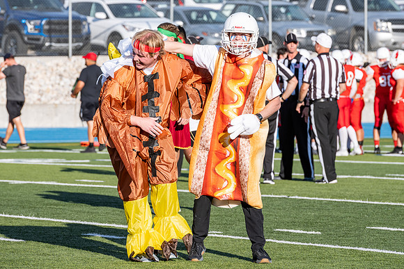 Students gather at the stadium to watch the football championship.