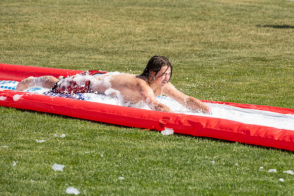 Students gather by the upper fields on the BYU-Idaho Campus to play recreation games, slip 'n' slide, mud volleyball, and try the ropes course.