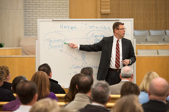 President Gilbert meets with employees in the Taylor Chapel.