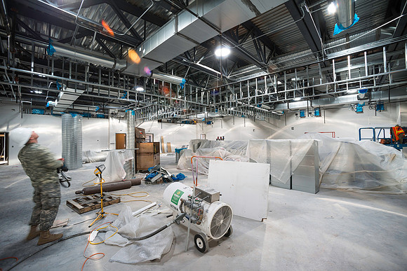 This room will be made into four separate classrooms using vertically-folding partitions. These partitions can be raised to form two chapels for large gatherings.