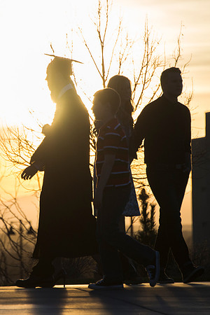 Graduate walks to convocation after the commencement ceremony.