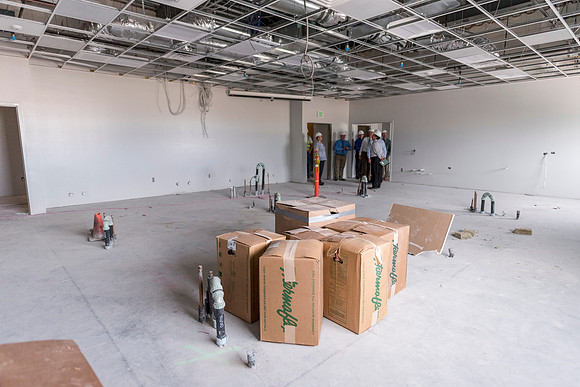 Faculty Members tour the new science building while it is still under construction.