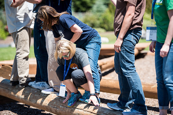 Online Instructors come to BYU-Idaho campus for further learning to enhance teaching skills. Instructors take their turn at the Ropes Course.