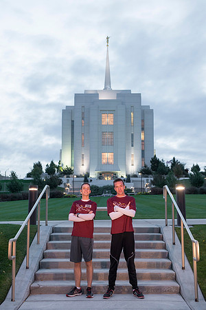 Team members pose by the Rexburg temple before they begin the temple to temple run