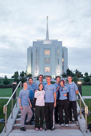 Team members pose by the Rexburg temple before they begin the temple to temple run
