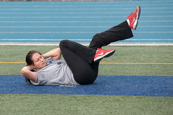 Doing some crunches on the stadium track.