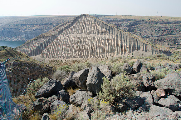 June 5, 1976 the recently built Teton Dam had failed emptying it's 280 foot deep reservoir downstream. The remains of the dam stand as monument to the 11 people who lost their lives.