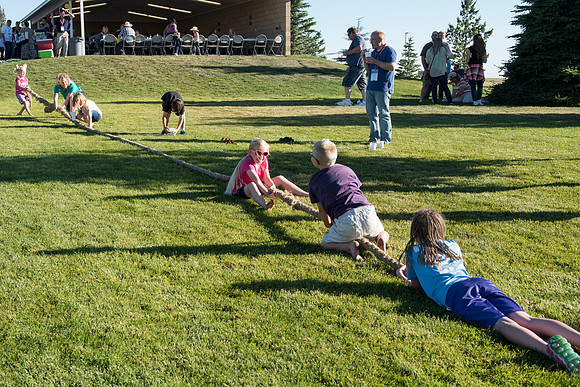 Faculty and their families, as part of the Online Learning & Teaching Conference, join together for dinner and games.