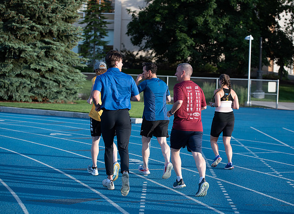 Faculty and community members of BYUI at Speed and Agility triathlete trannings at the stadium.