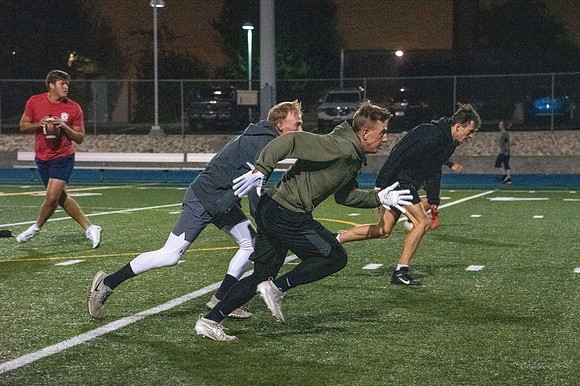 Students playing football.