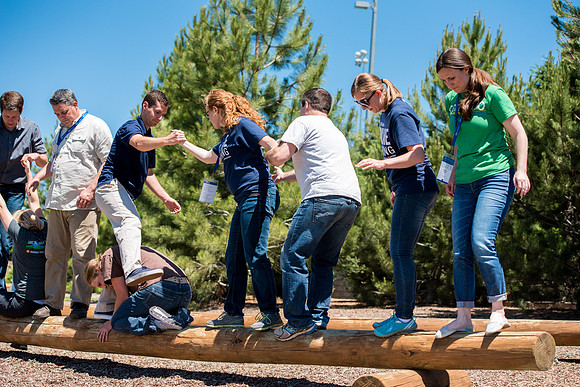 Online Instructors come to BYU-Idaho campus for further learning to enhance teaching skills. Instructors take their turn at the Ropes Course.