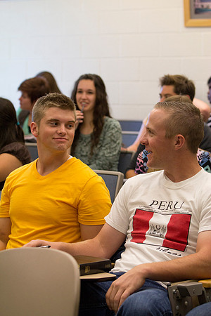 Students talk to each other before class starts
