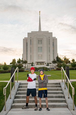 Team members pose by the Rexburg temple before they begin the temple to temple run