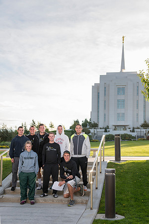 Team members pose by the Rexburg temple before they begin the temple to temple run