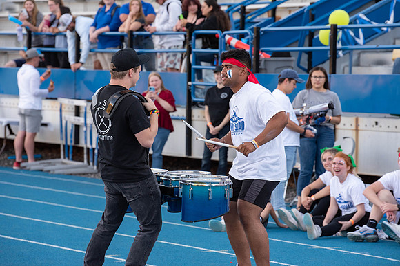 BYU-Idaho Football Teams compete in the Final Game of the Season. Students cheer them on from the stands, as the spirit team and Rix Stix Rally them up.