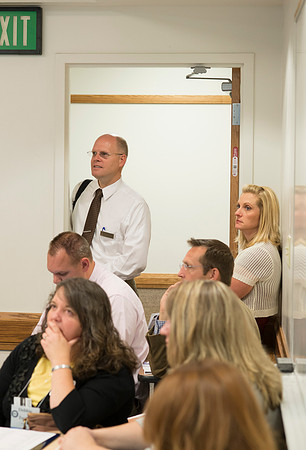 Faculty gather in the Hinckley Building at a Faculty Conference to share and learn from each other at the beginning of the 2013 Fall semester.