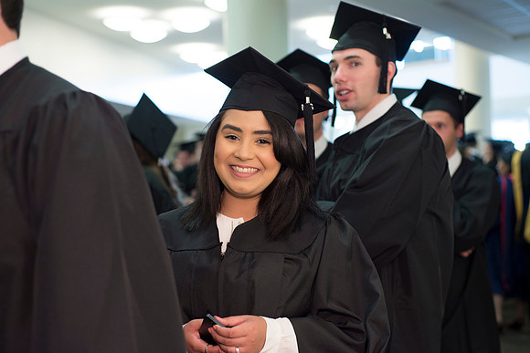 Graduates march the Processional into the I-Center. Photo by Leanna Davidson