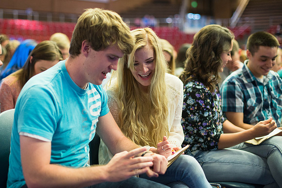 Students gather in the Hart auditorium for a date night with the Gilbert's.