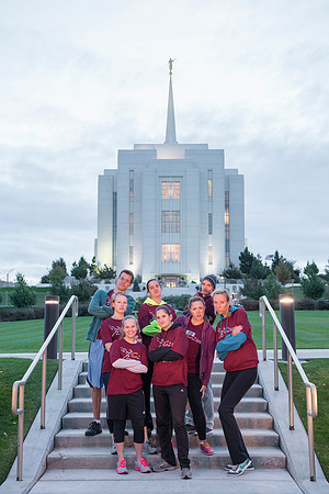 Team members pose by the Rexburg temple before they begin the temple to temple run