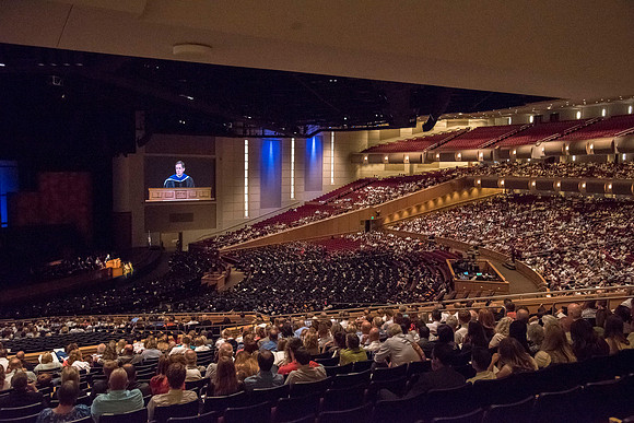 Mark B. Woodruff, Assistant to the Commissioner and Secretary to the Church Board of Education and Board of Trustees, addresses graduates at commencement. Photo by Ryan Chase