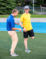 Faculty and community members of BYUI at Speed and Agility triathlete trannings at the stadium.