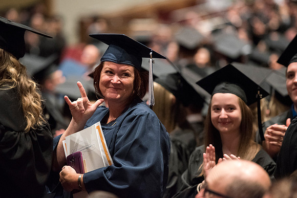 Graduates thanking their friends and family during Convocation ceremony. Photo by Ryan Chase