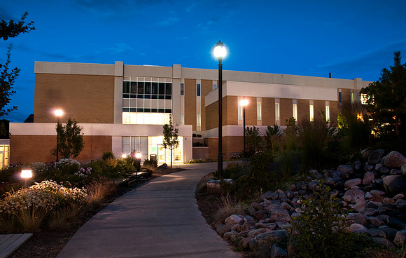 John L. Clarke Building at dusk.