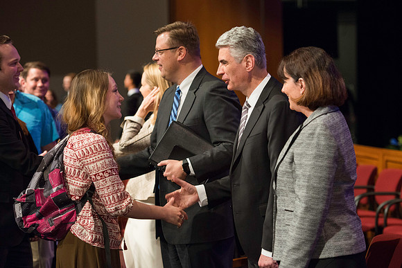 Bishop Gérald Caussé and his wife greet students after devotional.