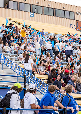 Students gather at the stadium to watch the football championship.