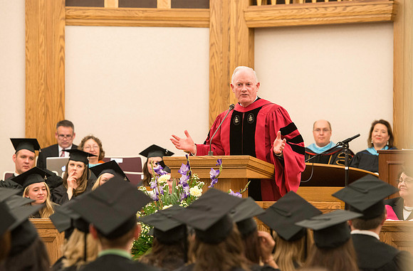 Elder Kim B. Clark, Commissioner of Church Education, shares his remarks and congratulates students as they receive their diplomas.