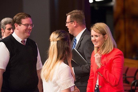 President and Sister Gilbert greet students after the first devotional of the semester.