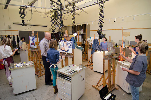 David Belka enthusiatically teaches painting principles to beginning painting class.