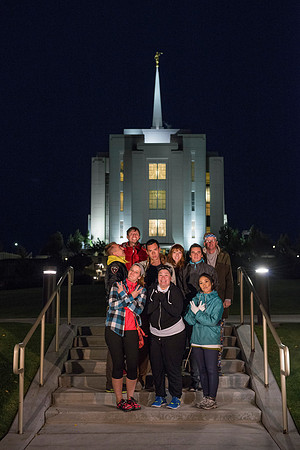 Team members pose by the Rexburg temple before they begin the temple to temple run