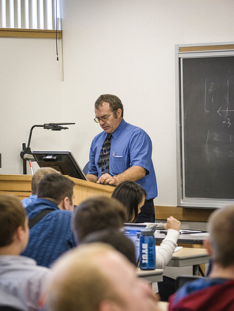 Professor Daris Howard teaches students on the first day of class.