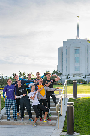 Team members pose by the Rexburg temple before they begin the temple to temple run