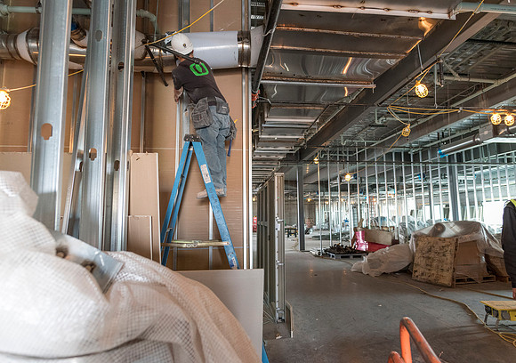 Faculty Members tour the new science building while it is still under construction.