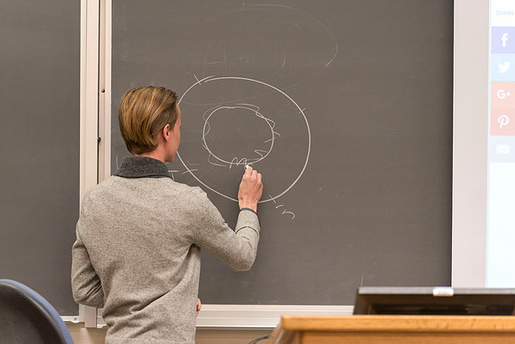 Teacher Assistant, Bobby Holder, discusses with his class about deviating from the norm and the effect it can have on society.
