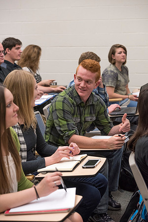 Students working with each other in the Foundations of the Restoration course on campus.